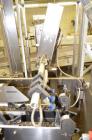 Used ADCO 15dz60 Horizontal Cartoner. Capable of speeds up to 60 cartons per minute. Has 12