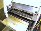 Used Econocorp Twinseal Carton Sealer, Model 4806. Capable of speeds up to 30 cartons per minute (1800 per hour). Has a carton size range: length 3/4