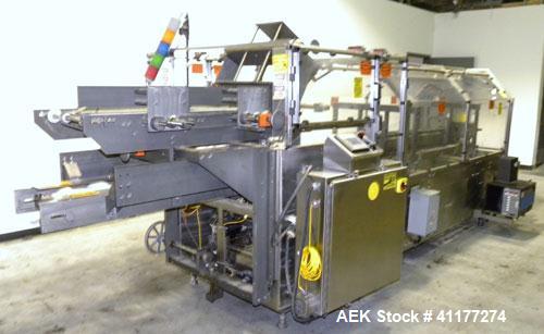 Used Adco Automatic Wraparound Carton Sleever, Model 12WA-125-33. Capable of speeds up to 125 cpm. Fully automatic multipack system for packaging beverage bottles, cans, cups, tubs, trays up to 125 s...