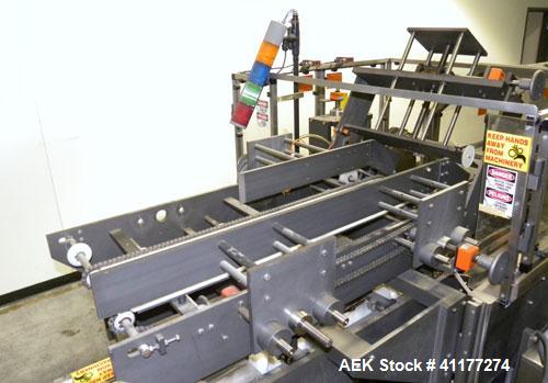 Used Adco Automatic Wraparound Carton Sleever, Model 12WA-125-33. Capable of speeds up to 125 cpm. Fully automatic multipack system for packaging beverage bottles, cans, cups, tubs, trays up to 125 s...