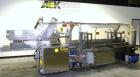 Used Adco Automatic Wraparound Carton Sleever, Model 12WA-125-33. Capable of speeds up to 125 cpm. Fully automatic multipack system for packaging beverage bottles, cans, cups, tubs, trays up to 125 s...