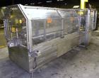 Used Adco Automatic Wraparound Carton Sleever, Model 12WA-125-33. Capable of speeds up to 125 cpm. Fully automatic multipack system for packaging beverage bottles, cans, cups, tubs, trays up to 125 s...