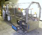 Used Adco Automatic Wraparound Carton Sleever, Model 12WA-125-33. Capable of speeds up to 125 cpm. Fully automatic multipack system for packaging beverage bottles, cans, cups, tubs, trays up to 125 s...