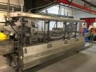 Used Switchback AM-3H Multi-Pack Sleeve Style Cartoner. In-feed for 2 x 2 (inverted top layer) and 2 x 1 cups with 1:2 product divider. Overhead carton load, gluing and sealing of carton overlap seam...