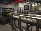 Used Switchback AM-3H Multi-Pack Sleeve Style Cartoner. In-feed for 2 x 2 (inverted top layer) and 2 x 1 cups with 1:2 product divider. Overhead carton load, gluing and sealing of carton overlap seam...