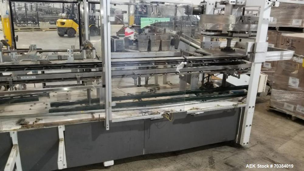 Used- Adco Vertical Cartoner. With 6" centers - set for macaroni and cheese boxes with foil pouch. Rotary carton pick off to...