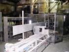 USED: Triangle model VCL1500 continuous motion vertical cartoner equipped with sift proof glue system which includes two Nordson 3800 glue tanks and a Nordson PC50 pattern controller, three head rota...