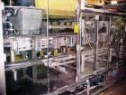 USED: Triangle model VCL1500 continuous motion vertical cartoner equipped with sift proof glue system which includes two Nordson 3800 glue tanks and a Nordson PC50 pattern controller, three head rota...