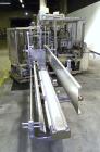 Used Yeaman Machine VCM-1000 Vertical Cartoner with 6 head volumetric cup fille