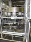 Used Yeaman Machine VCM-1000 Vertical Cartoner with 6 head volumetric cup fille