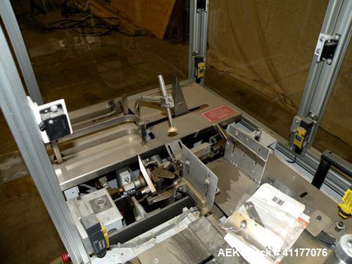 Used Bivans 54L Carton Former And Bottom Closer. Capable of speeds up to 60 cartons per minute. Has a carton size range: Length 1/2" - 8-7/8", Width 3/8"  - 7", Depth 1-1/8"- 14-1/16". Now tooled for...