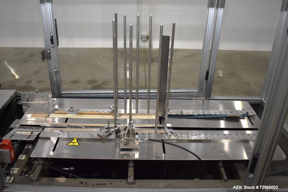 Used Bivans 54L Carton Former and Bottom Closer. Capable of speeds up to 60 cartons per minute. Has a carton size range:  1/2" - 8-7/8" (Length) x  3/8" - 7" (Width) x 1-1/8" - 14-1/16"  (Depth). Set...