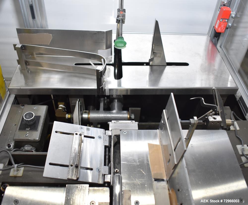 Used Bivans 54L Carton Former and Bottom Closer. Capable of speeds up to 60 cartons per minute. Has a carton size range:  1/2" - 8-7/8" (Length) x  3/8" - 7" (Width) x 1-1/8" - 14-1/16"  (Depth). Set...