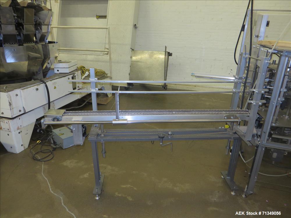 Used Clybourn Model CHL7 vertical hand load hot melt glue cartoner. Capable of speeds from 10 to 100 cartons per minute.  Set on 10" centers for a carton  size range: 1" - 8-1/4" length x 3/4" - 3-1/...