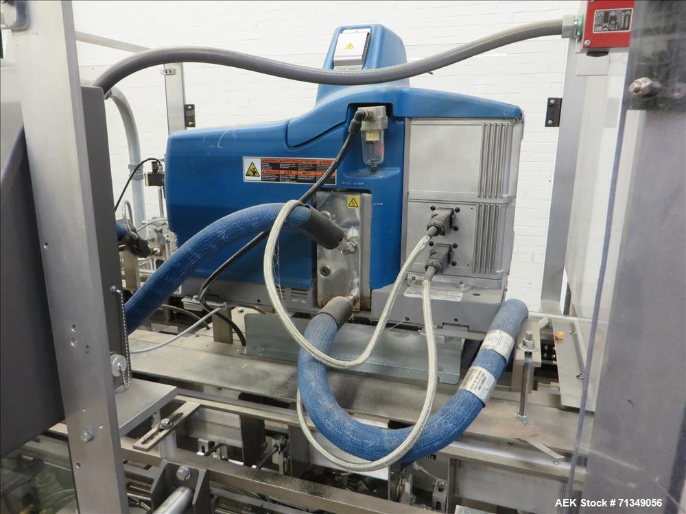 Used Clybourn Model CHL7 vertical hand load hot melt glue cartoner. Capable of speeds from 10 to 100 cartons per minute.  Set on 10" centers for a carton  size range: 1" - 8-1/4" length x 3/4" - 3-1/...