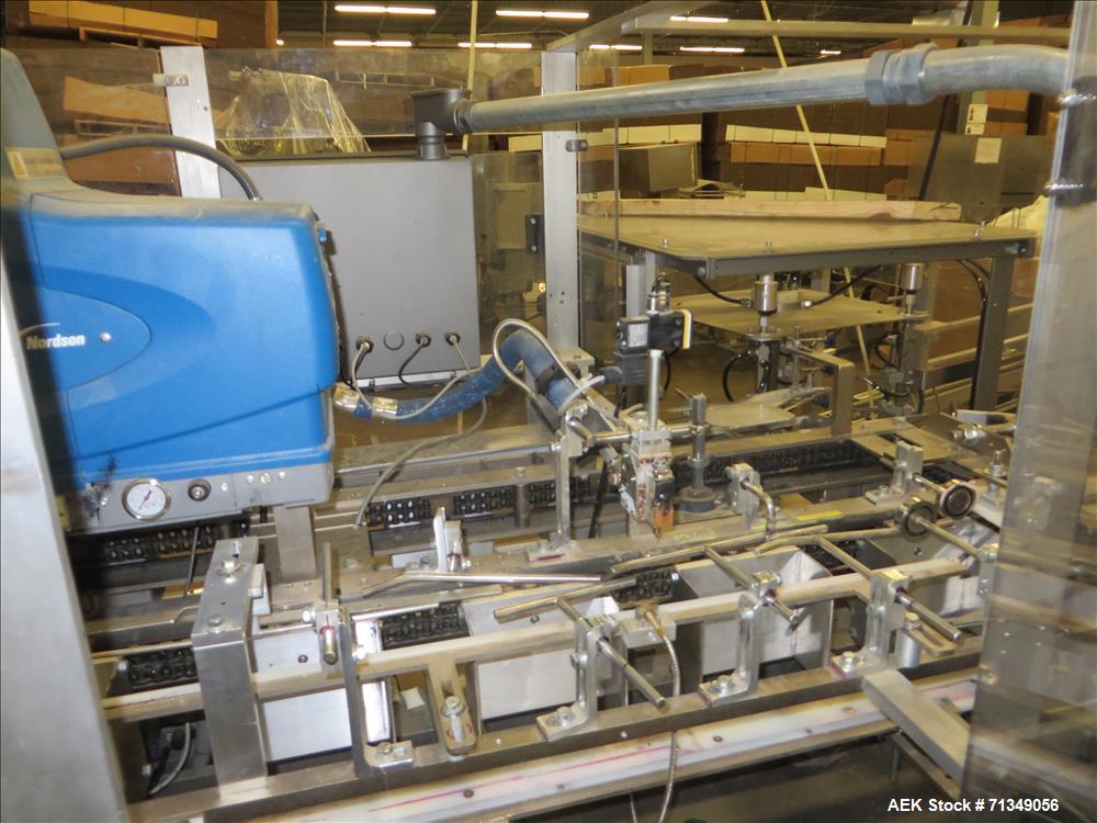Used Clybourn Model CHL7 vertical hand load hot melt glue cartoner. Capable of speeds from 10 to 100 cartons per minute.  Set on 10" centers for a carton  size range: 1" - 8-1/4" length x 3/4" - 3-1/...