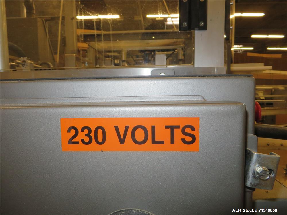 Used Clybourn Model CHL7 vertical hand load hot melt glue cartoner. Capable of speeds from 10 to 100 cartons per minute.  Set on 10" centers for a carton  size range: 1" - 8-1/4" length x 3/4" - 3-1/...