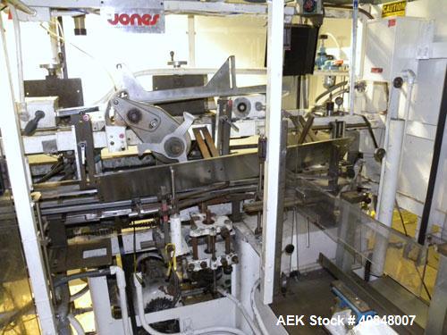 Used Jones Oystar Semi Automatic Vertical Cartoner, Model CMV. Capable of speeds up to 120 rpm. Has 5" centers for a carton size range: length 1" to 4-1/4", width 3/4" to 4-1/4", depth 2-1/8" to 8". ...
