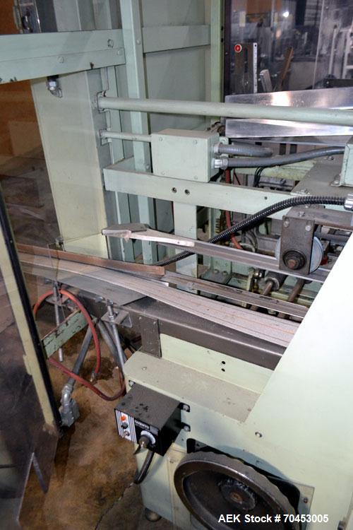Used Jones Model CMV5 Semi-Automatic Tuck Vertical Cartoner. Machine is capable of speeds up to 120 cartons per minute. Has manual load station of 8' (both sides). Has 5" centers for a carton size ra...