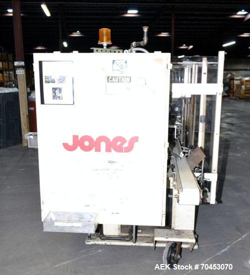 Used Jones Model CMV5 Semi-Automatic Tuck Vertical Cartoner. Machine is capable of speeds up to 120 cartons per minute. Has manual load station of 8' (both sides). Has 5" centers for a carton size ra...