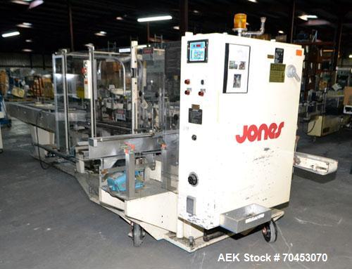 Used Jones Model CMV5 Semi-Automatic Tuck Vertical Cartoner. Machine is capable of speeds up to 120 cartons per minute. Has manual load station of 8' (both sides). Has 5" centers for a carton size ra...