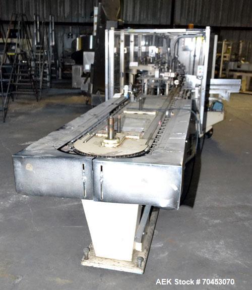 Used Jones Model CMV5 Semi-Automatic Tuck Vertical Cartoner. Machine is capable of speeds up to 120 cartons per minute. Has manual load station of 8' (both sides). Has 5" centers for a carton size ra...
