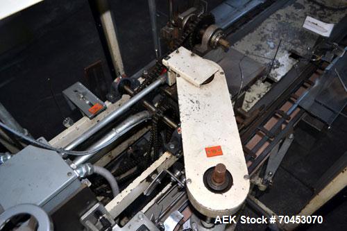 Used Jones Model CMV5 Semi-Automatic Tuck Vertical Cartoner. Machine is capable of speeds up to 120 cartons per minute. Has manual load station of 8' (both sides). Has 5" centers for a carton size ra...