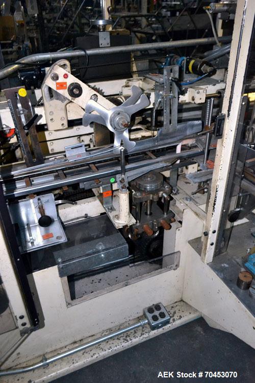 Used Jones Model CMV5 Semi-Automatic Tuck Vertical Cartoner. Machine is capable of speeds up to 120 cartons per minute. Has manual load station of 8' (both sides). Has 5" centers for a carton size ra...