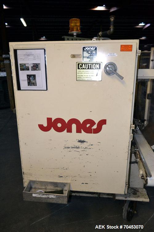 Used Jones Model CMV5 Semi-Automatic Tuck Vertical Cartoner. Machine is capable of speeds up to 120 cartons per minute. Has manual load station of 8' (both sides). Has 5" centers for a carton size ra...