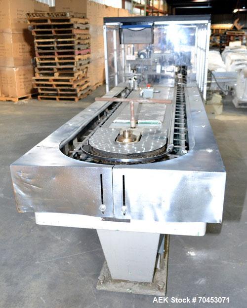 Used Jones Model CMV5 Semi-Automatic Tuck Vertical Cartoner. Machine is capable of speeds up to 120 cartons per minute. Has manual load station of 8' (both sides). Has 5" centers for a carton size ra...