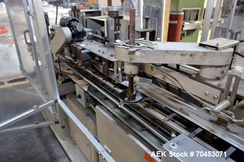 Used Jones Model CMV5 Semi-Automatic Tuck Vertical Cartoner. Machine is capable of speeds up to 120 cartons per minute. Has manual load station of 8' (both sides). Has 5" centers for a carton size ra...