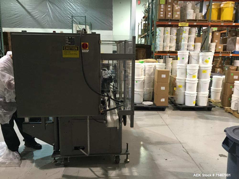 Used- Jones CMV5 Semi Automatic Continuous Motion Vertical Hot Melt Tuck Cartoner. Capable of speeds up to 120 cpm. Has 5" c...