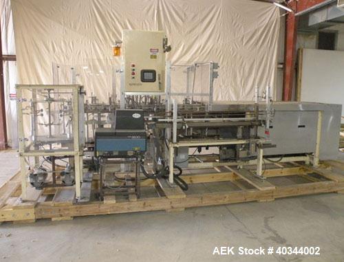 Used Paxall Clybourn Semi Automatic Vertical Hot Melt Cartoner, Model CHL-A. Capable of speeds up to 120 cpm. Has 6' long powered carton magazine with rotary carton feeder. Currently set up on 5" cen...