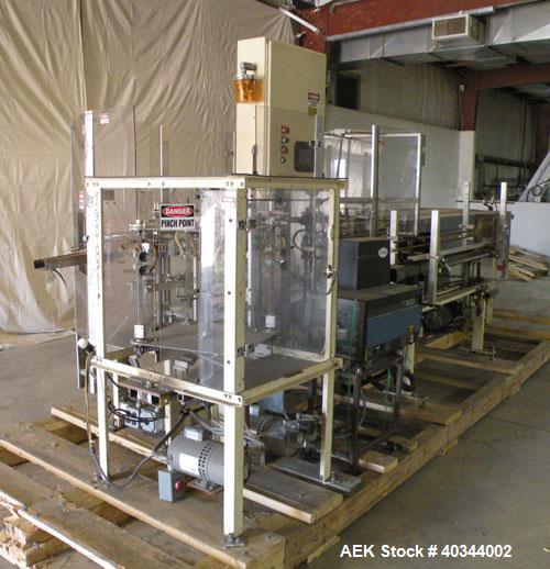 Used Paxall Clybourn Semi Automatic Vertical Hot Melt Cartoner, Model CHL-A. Capable of speeds up to 120 cpm. Has 6' long powered carton magazine with rotary carton feeder. Currently set up on 5" cen...