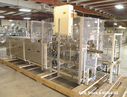 Used Paxall Clybourn Semi Automatic Vertical Hot Melt Cartoner, Model CHL-A. Capable of speeds up to 120 cpm. Has 6' long powered carton magazine with rotary carton feeder. Currently set up on 5" cen...