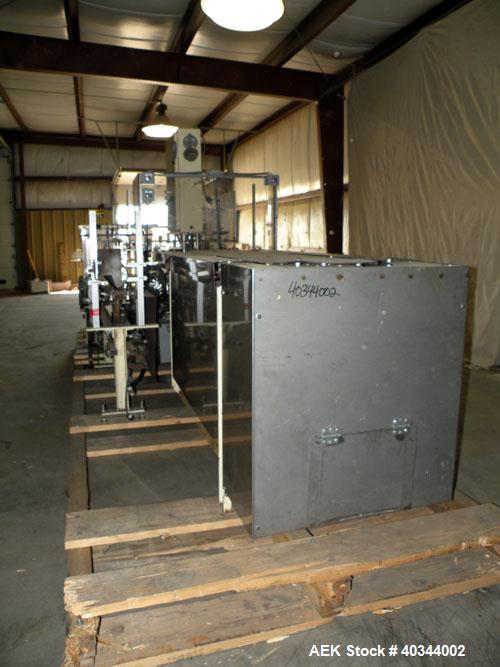 Used Paxall Clybourn Semi Automatic Vertical Hot Melt Cartoner, Model CHL-A. Capable of speeds up to 120 cpm. Has 6' long powered carton magazine with rotary carton feeder. Currently set up on 5" cen...