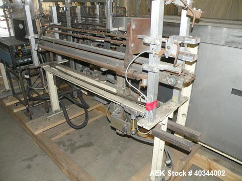 Used Paxall Clybourn Semi Automatic Vertical Hot Melt Cartoner, Model CHL-A. Capable of speeds up to 120 cpm. Has 6' long powered carton magazine with rotary carton feeder. Currently set up on 5" cen...