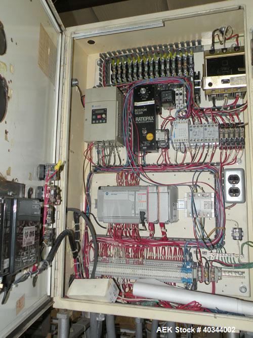 Used Paxall Clybourn Semi Automatic Vertical Hot Melt Cartoner, Model CHL-A. Capable of speeds up to 120 cpm. Has 6' long powered carton magazine with rotary carton feeder. Currently set up on 5" cen...