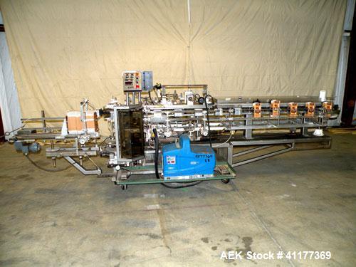 Used Tisma Intermittent Motion Vertical Hot Melt Cartoner, Model TC-50-E. Capable of speeds up to 60 CPM. Has 10" centers, two head rotary carton feeder with 36" long carton magazine and 5' load area...