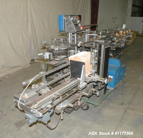 Used Tisma Intermittent Motion Vertical Hot Melt Cartoner, Model TC-50-E. Capable of speeds up to 60 CPM. Has 10" centers, two head rotary carton feeder with 36" long carton magazine and 5' load area...