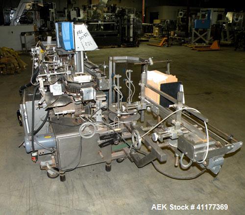 Used Tisma Intermittent Motion Vertical Hot Melt Cartoner, Model TC-50-E. Capable of speeds up to 60 CPM. Has 10" centers, two head rotary carton feeder with 36" long carton magazine and 5' load area...