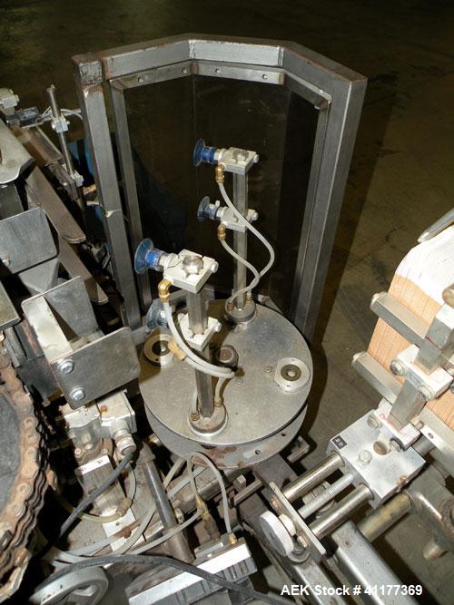 Used Tisma Intermittent Motion Vertical Hot Melt Cartoner, Model TC-50-E. Capable of speeds up to 60 CPM. Has 10" centers, two head rotary carton feeder with 36" long carton magazine and 5' load area...
