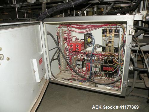 Used Tisma Intermittent Motion Vertical Hot Melt Cartoner, Model TC-50-E. Capable of speeds up to 60 CPM. Has 10" centers, two head rotary carton feeder with 36" long carton magazine and 5' load area...