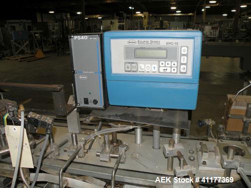 Used Tisma Intermittent Motion Vertical Hot Melt Cartoner, Model TC-50-E. Capable of speeds up to 60 CPM. Has 10" centers, two head rotary carton feeder with 36" long carton magazine and 5' load area...