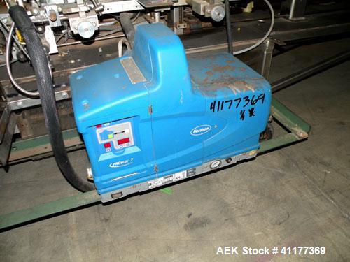 Used Tisma Intermittent Motion Vertical Hot Melt Cartoner, Model TC-50-E. Capable of speeds up to 60 CPM. Has 10" centers, two head rotary carton feeder with 36" long carton magazine and 5' load area...