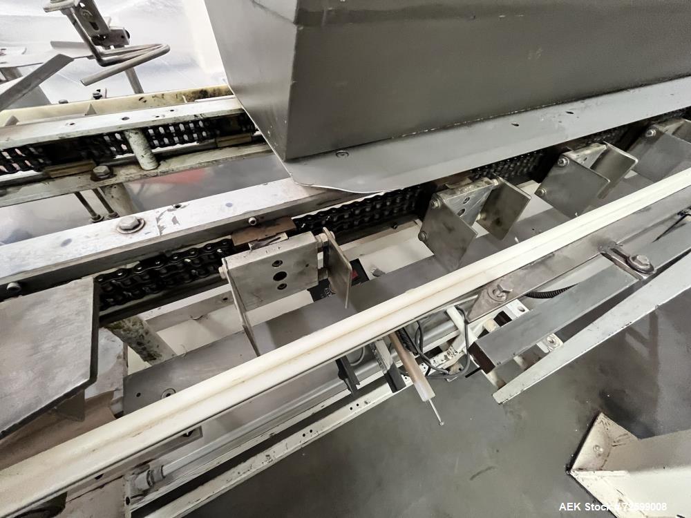Used Clybourn CHL Vertical Hand Load Hot Melt Glue Cartoner. Capable of speeds from 10 to 100 cartoners per minute. Set on 10" centers for a carton size range: 1" to 8-1/4" length x 3/4" to 3-1/4" wi...