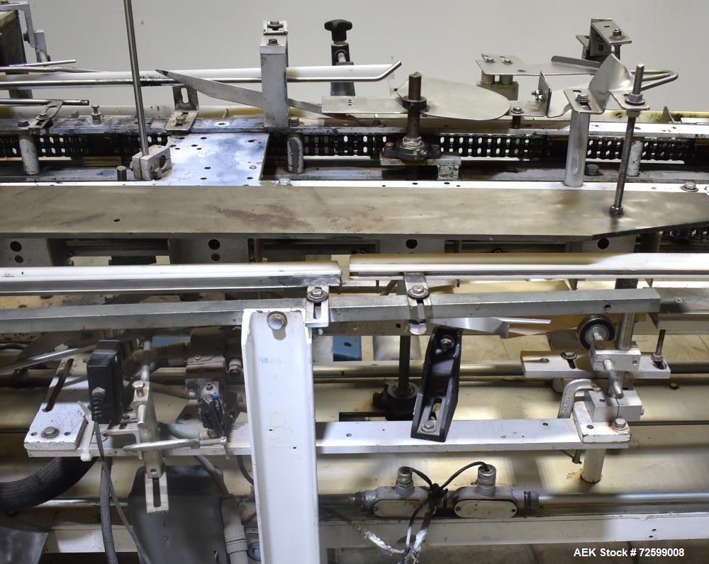 Used Clybourn CHL Vertical Hand Load Hot Melt Glue Cartoner. Capable of speeds from 10 to 100 cartoners per minute. Set on 10" centers for a carton size range: 1" to 8-1/4" length x 3/4" to 3-1/4" wi...