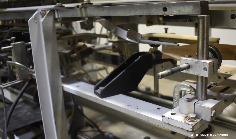 Used Clybourn CHL Vertical Hand Load Hot Melt Glue Cartoner. Capable of speeds from 10 to 100 cartoners per minute. Set on 10" centers for a carton size range: 1" to 8-1/4" length x 3/4" to 3-1/4" wi...