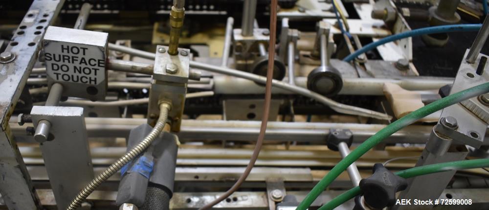 Used Clybourn CHL Vertical Hand Load Hot Melt Glue Cartoner. Capable of speeds from 10 to 100 cartoners per minute. Set on 10" centers for a carton size range: 1" to 8-1/4" length x 3/4" to 3-1/4" wi...