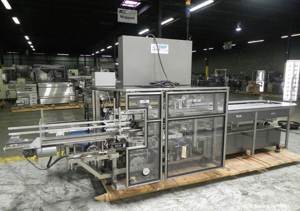 Used Tisma (SWF) VT-100-RH Vertical Cartoner with glue flap closures. Capable of speeds up to 200 cartons per minute. Unit has 7.5" centers for a carton size range: length 1" to 6.25", width .5" to 3...